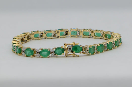 "BRAC01355" Oval Emerald and Round Diamond Yellow Gold Tennis Bracelet