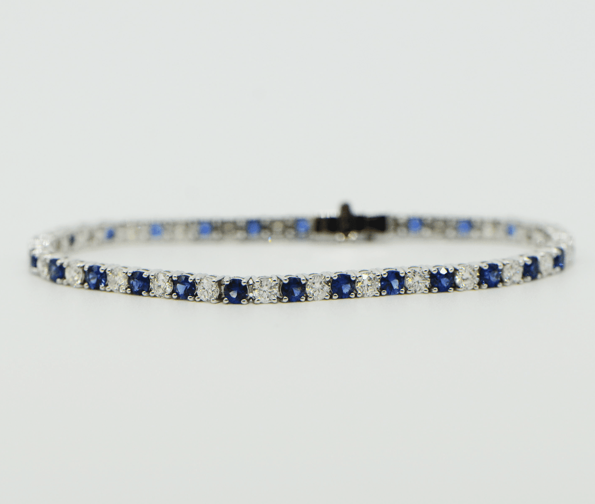 "BRAC01384" Sapphire and Diamond 18K White Gold Tennis Bracelet