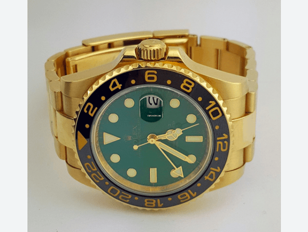 Rolex GMT Master II 18k Yellow and Steel RARE Green Dial MINT