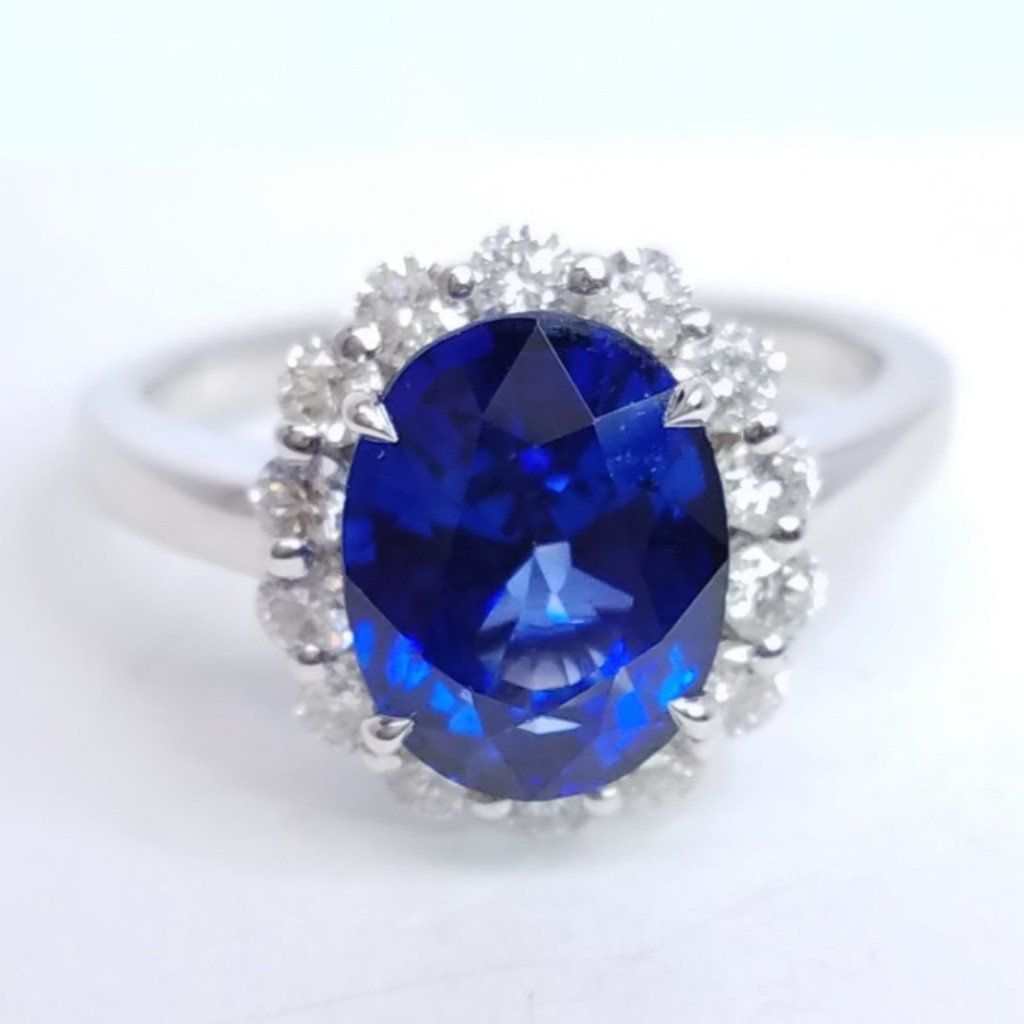 3.75 Total Carat Oval Blue Sapphire and Diamond Halo Ladies Engagement Ring