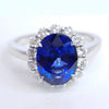 3.75 Total Carat Oval Blue Sapphire and Diamond Halo Ladies Engagement Ring