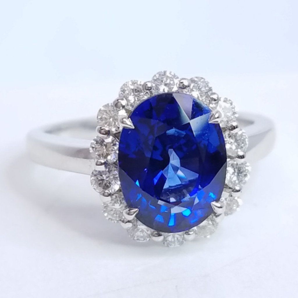 3.75 Total Carat Oval Blue Sapphire and Diamond Halo Ladies Engagement Ring