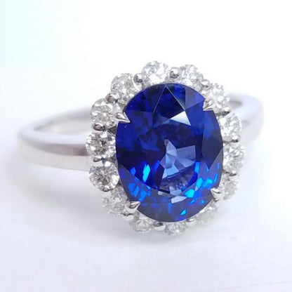 3.75 Total Carat Oval Blue Sapphire and Diamond Halo Ladies Engagement Ring