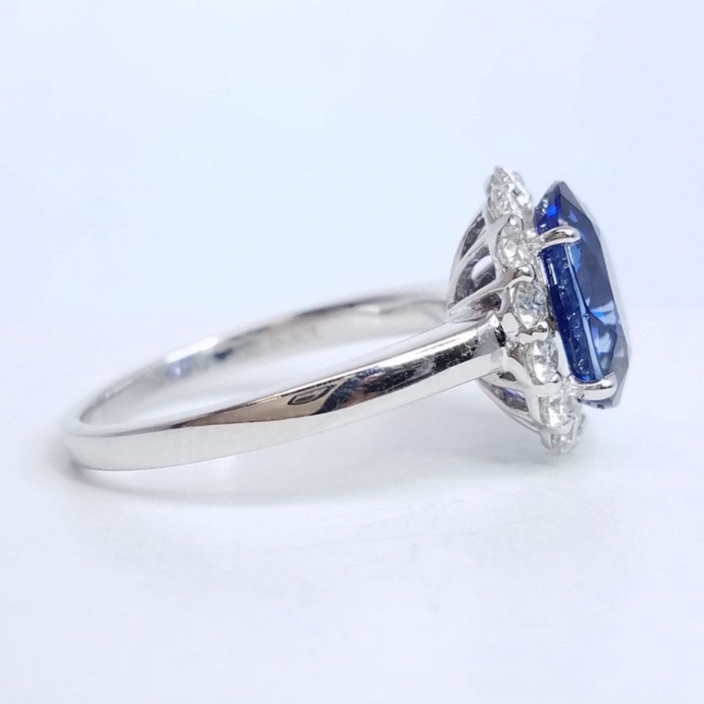 3.75 Total Carat Oval Blue Sapphire and Diamond Halo Ladies Engagement Ring