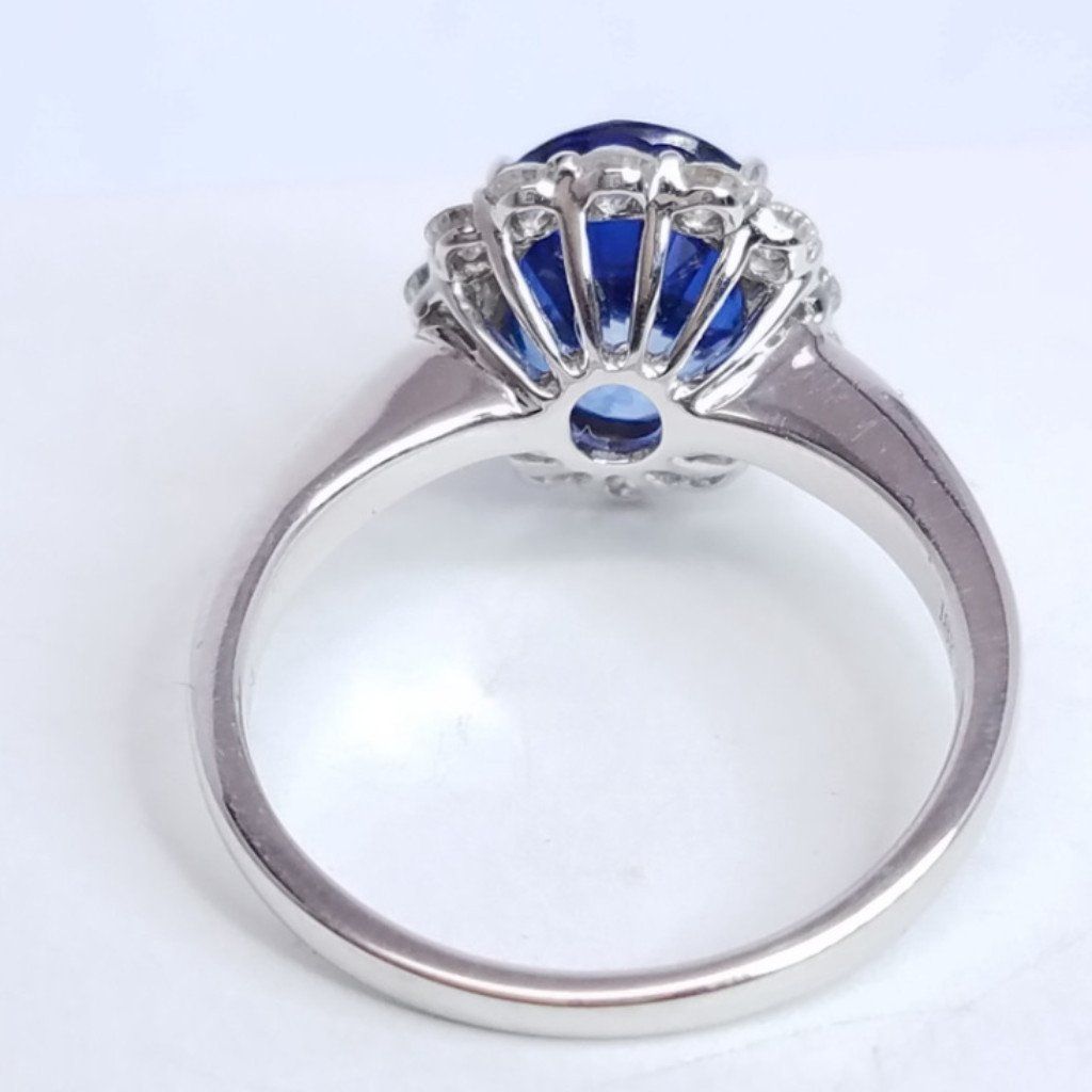 3.75 Total Carat Oval Blue Sapphire and Diamond Halo Ladies Engagement Ring
