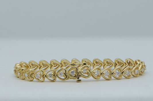 "BRAC01043" Round Diamonds Prong Set in Heart Shape Tennis Bracelet