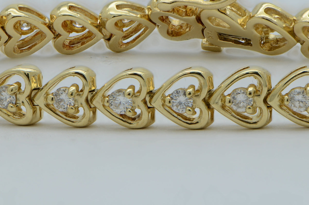 "BRAC01043" Round Diamonds Prong Set in Heart Shape Tennis Bracelet