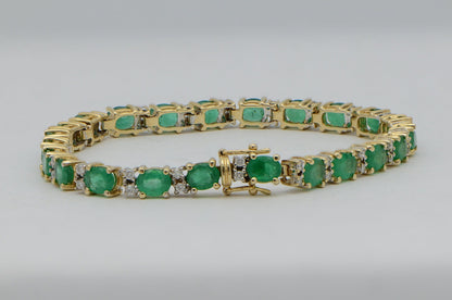 "BRAC01355" Oval Emerald and Round Diamond Yellow Gold Tennis Bracelet
