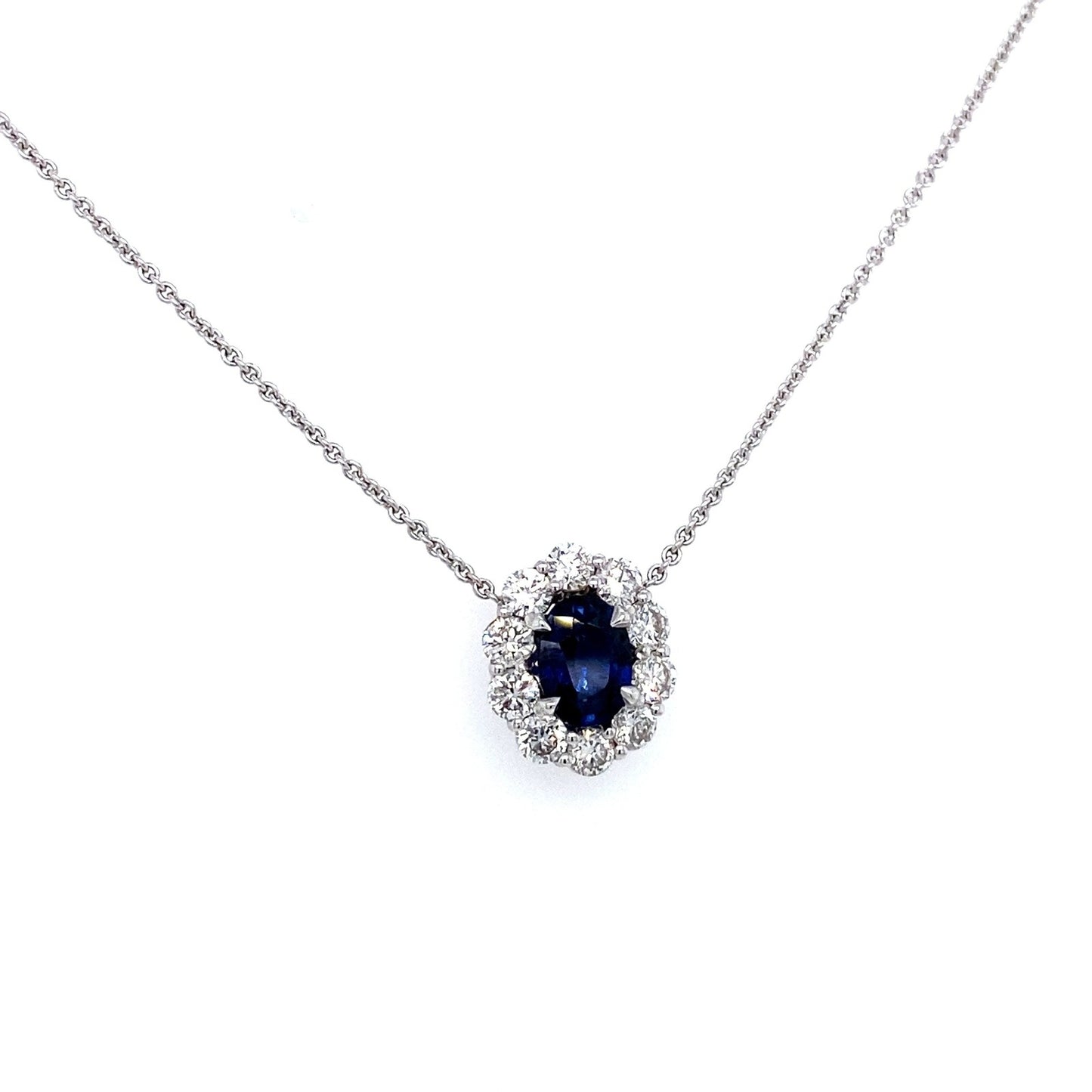 "PEND01794" Oval Shaped Sapphire and Diamond Halo Pendant in 18K White Gold