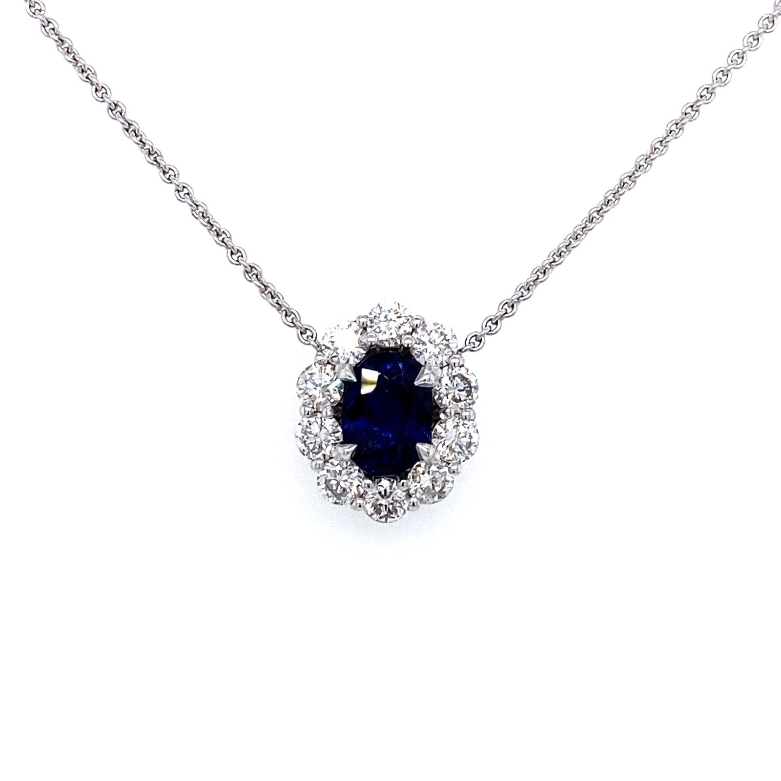 "PEND01794" Oval Shaped Sapphire and Diamond Halo Pendant in 18K White Gold