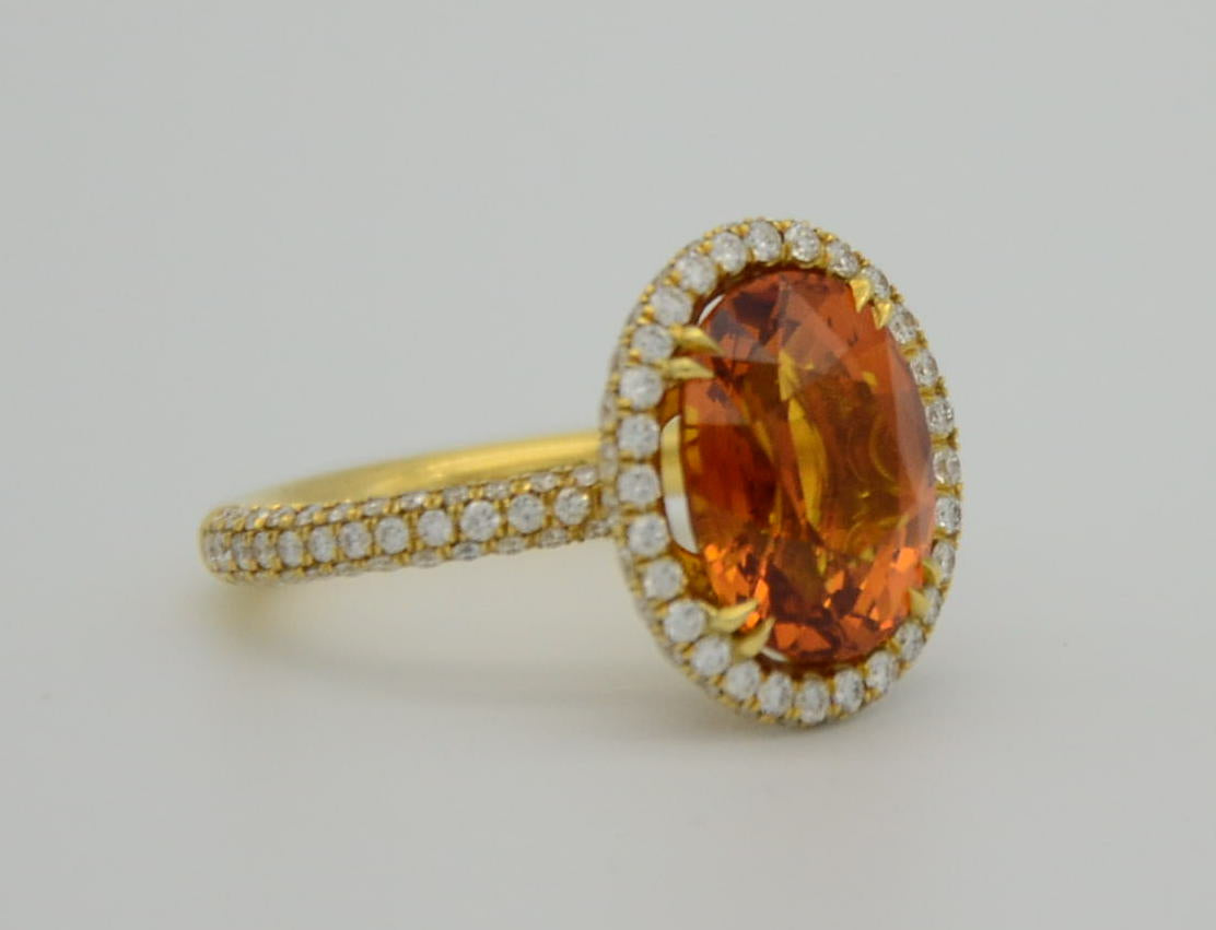 9.28 Total Carat Orange Sapphire and Diamond Halo Ladies Ring. GIA Certified.