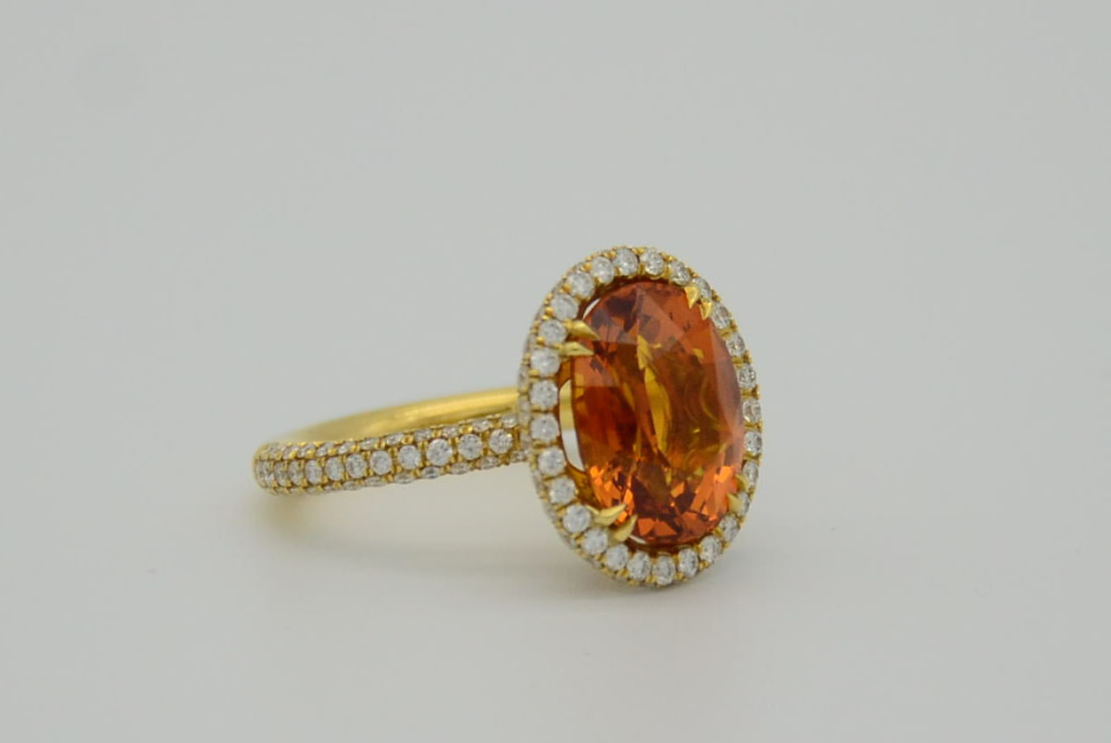 9.28 Total Carat Orange Sapphire and Diamond Halo Ladies Ring. GIA Certified.