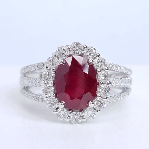 2.90 Total Carat Oval Ruby and Diamond Halo Ladies Ring. GIA Certified.