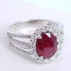 2.90 Total Carat Oval Ruby and Diamond Halo Ladies Ring. GIA Certified.