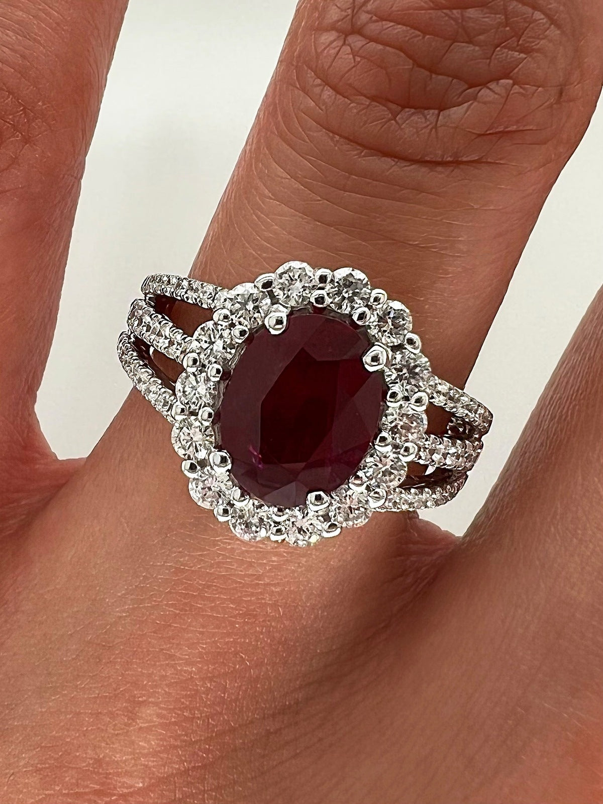 2.90 Total Carat Oval Ruby and Diamond Halo Ladies Ring. GIA Certified.