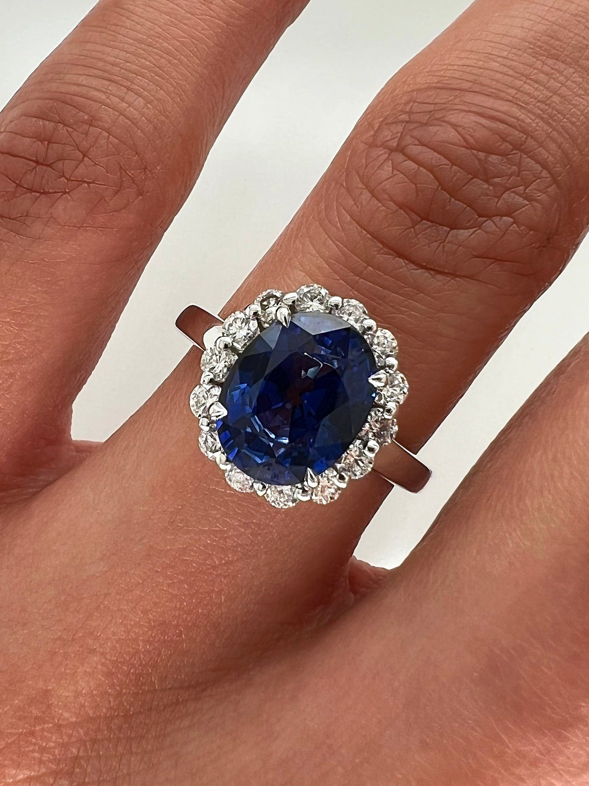 3.75 Total Carat Oval Blue Sapphire and Diamond Halo Ladies Engagement Ring