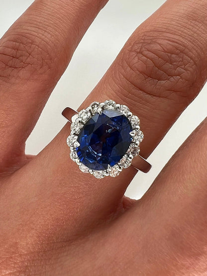 3.75 Total Carat Oval Blue Sapphire and Diamond Halo Ladies Engagement Ring