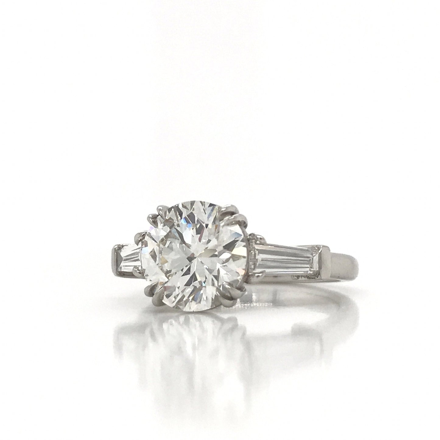 "ENGR03327" Round Diamond With Side Baguettes Three Stone Engagement Ring