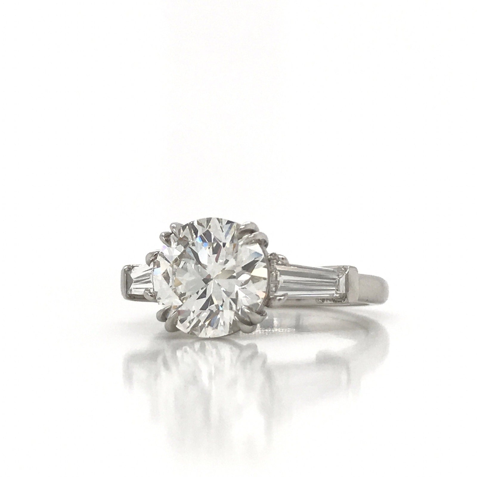 "ENGR03327" Round Diamond With Side Baguettes Three Stone Engagement Ring
