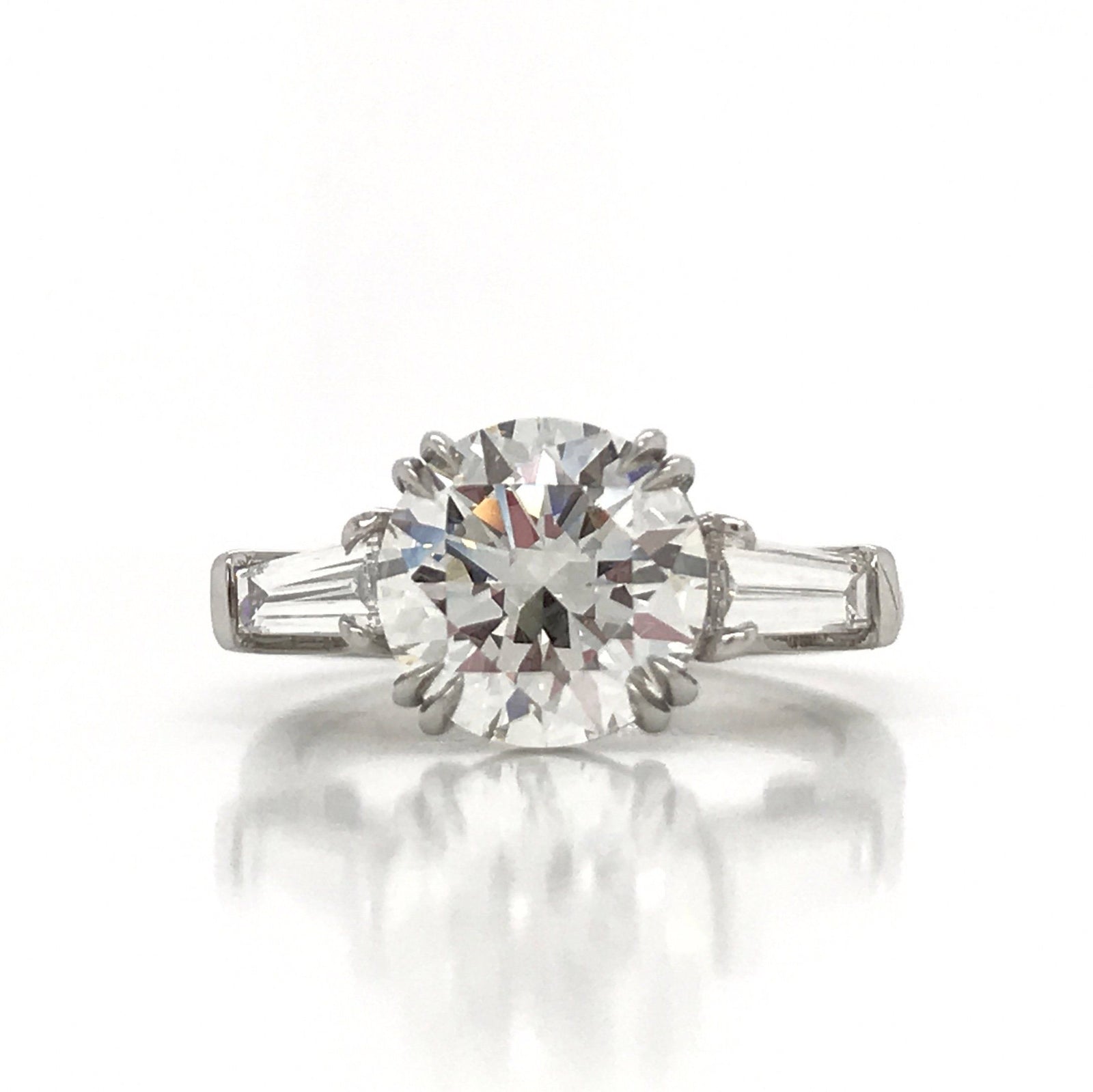 "ENGR03327" Round Diamond With Side Baguettes Three Stone Engagement Ring