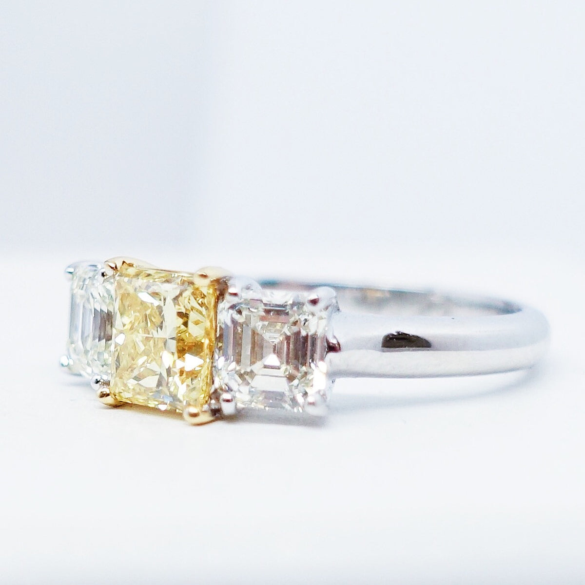 1.94 Total Carat Fancy Yellow Diamond Three Stone Ladies Engagement Ring. GIA Certified.