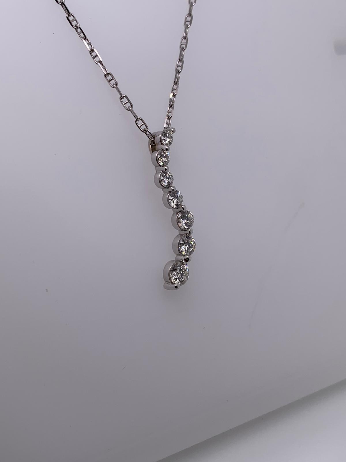 "PEND01231" 18K White Gold Seven Diamond Wave Pendant