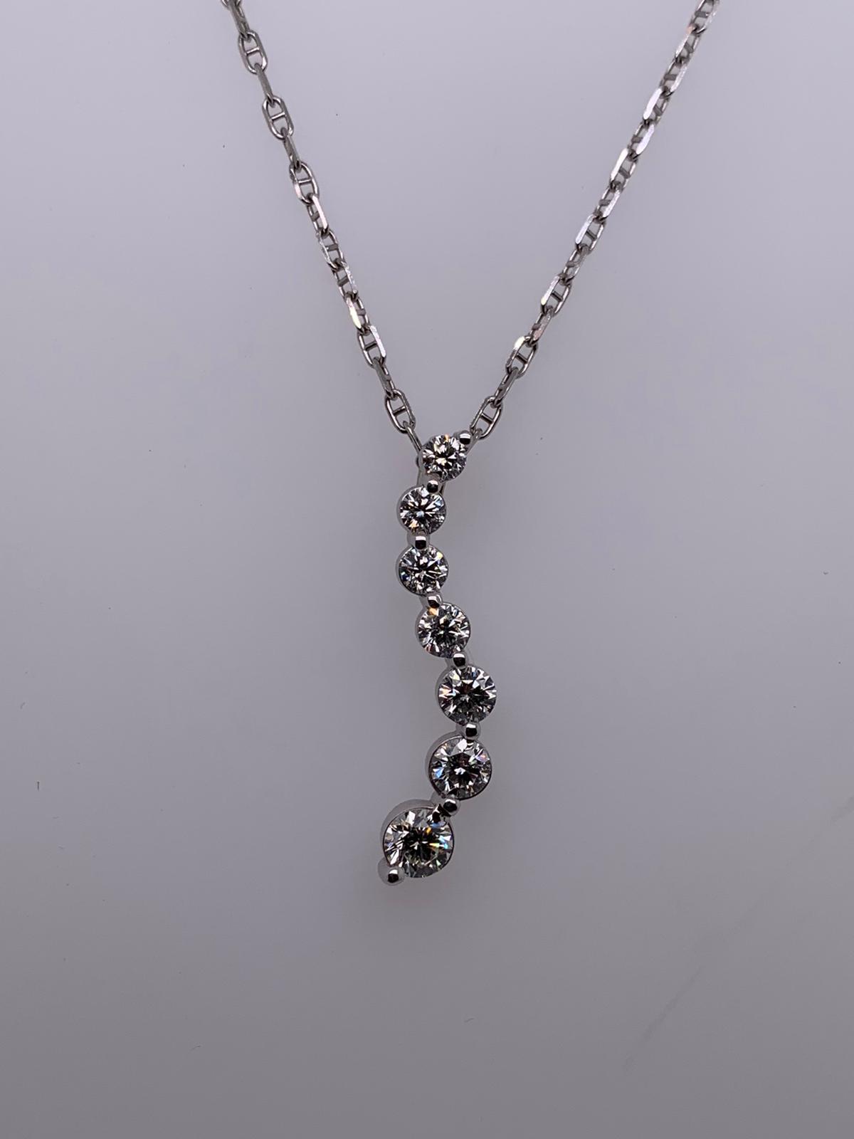 "PEND01231" 18K White Gold Seven Diamond Wave Pendant