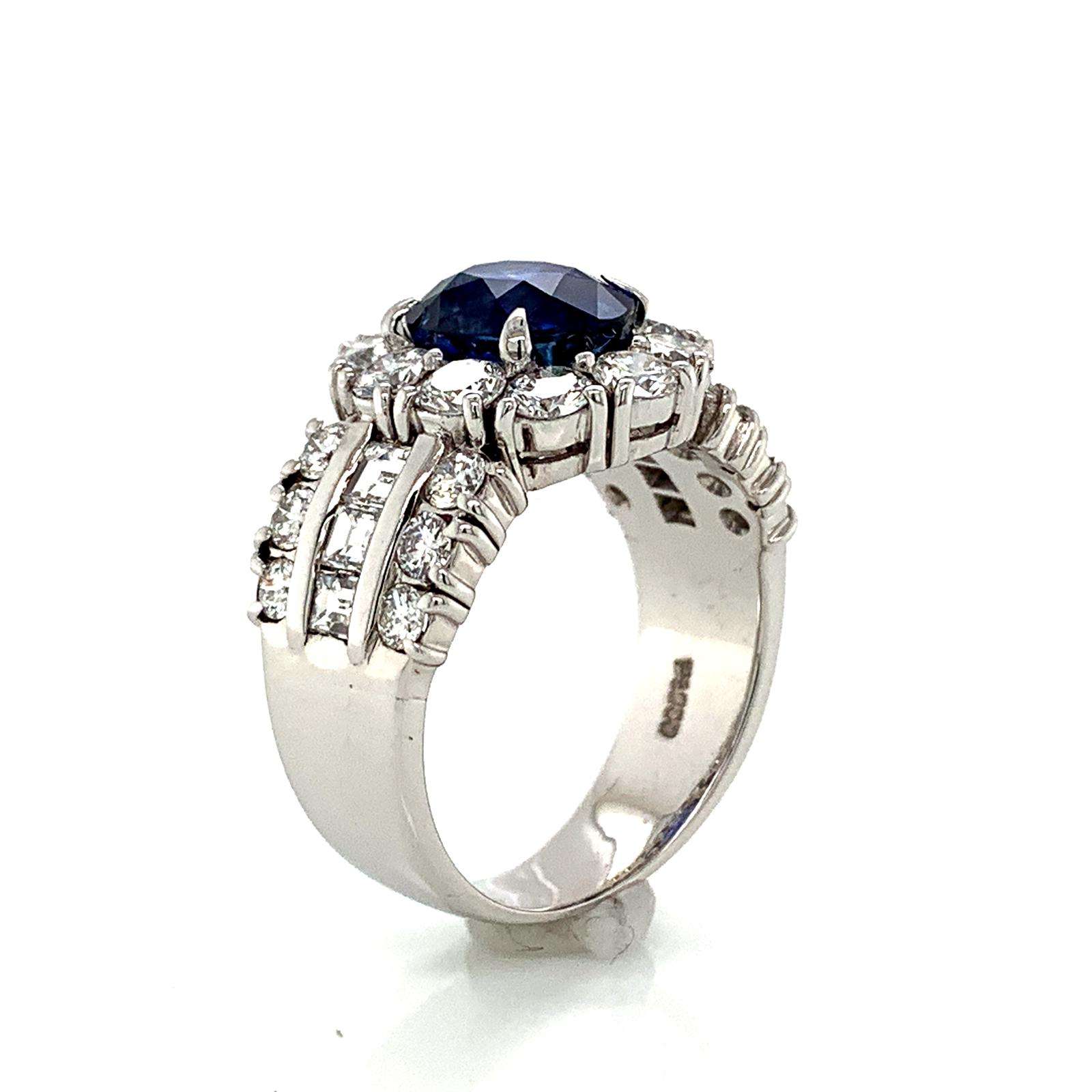 Sapphire and Diamond Halo Ladies Ring with Side Diamonds in Platinum